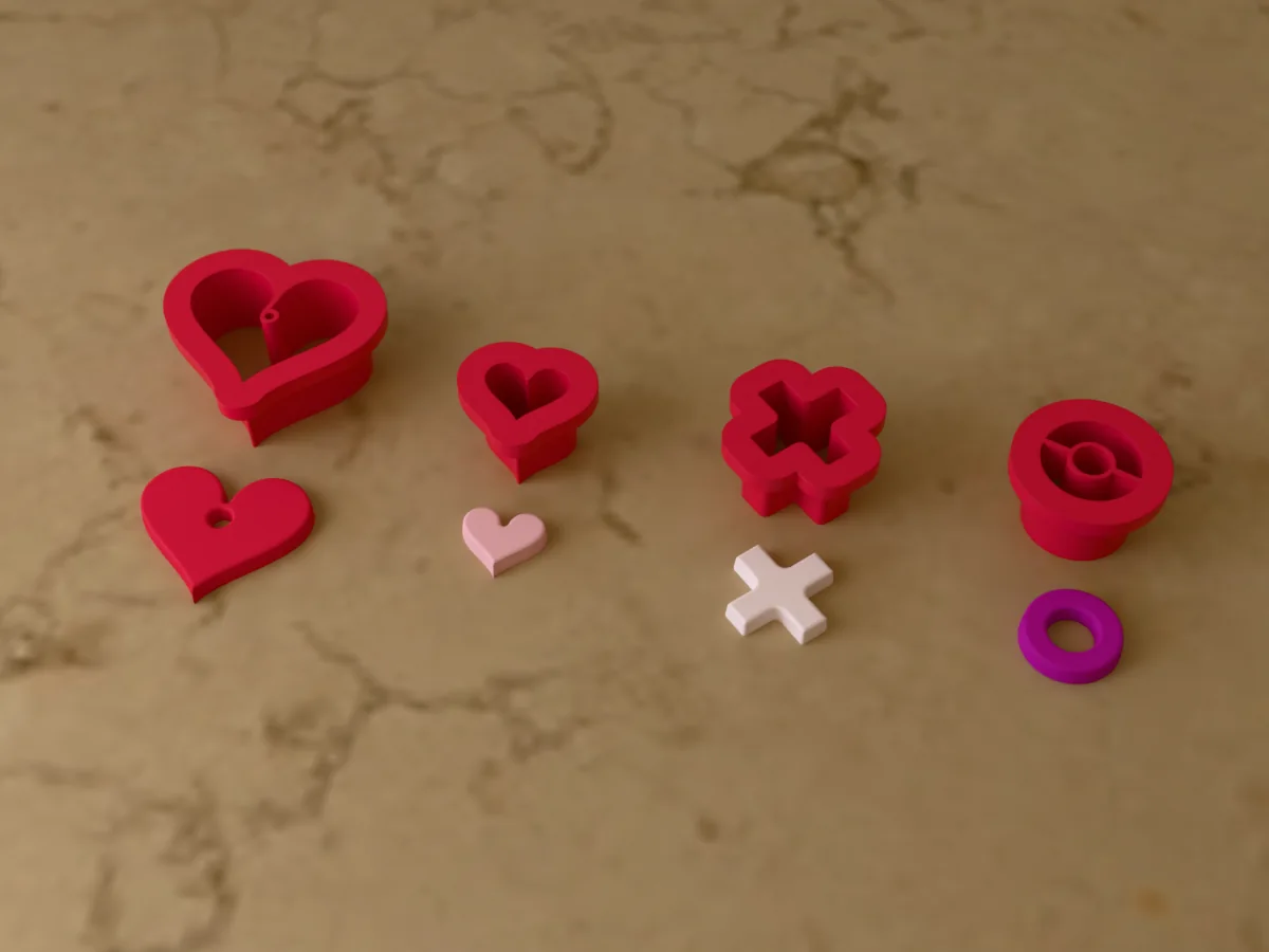 3D render of four 3D-printed red polymer clay earring cutters (heart 28 mm, heart 14 mm, x 16 mm and o 16 mm) with the clay earring pieces they cut in front
