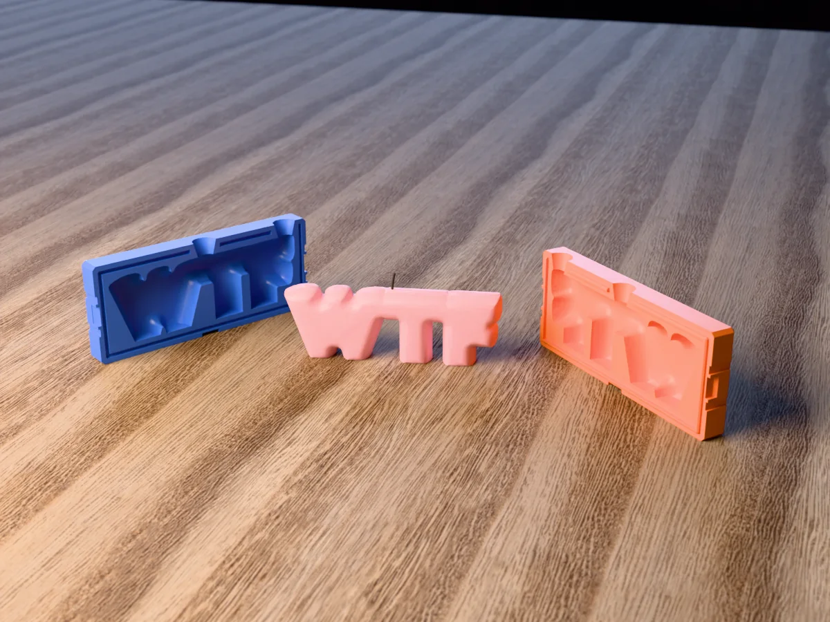 3D render of a WTF bubble letter candle between the two printed halves of its rigid orange and blue mold