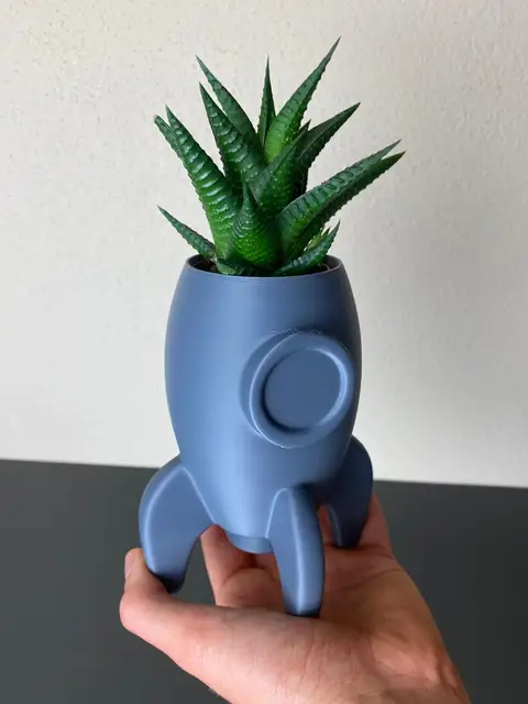 A rocket-shaped succulent planter, 3D-printed with the Planter tool.