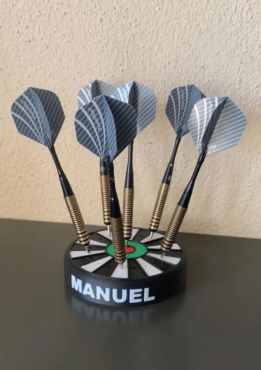 A personalized 3D-printed dart stand holding several darts, made with the Dart holder generator