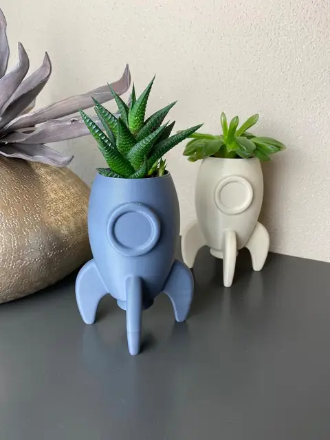 Rocket succulent planters 3D-printed in two colors, from the Planter tool.