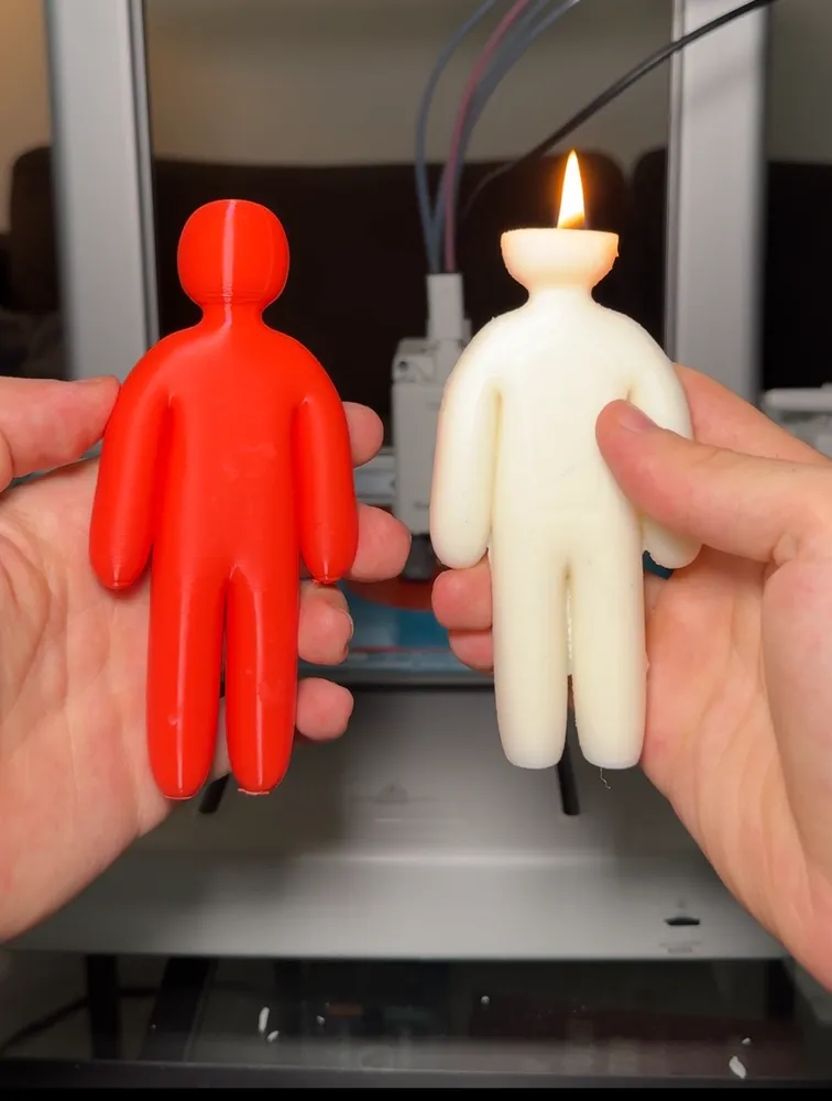 A 3D-printed model held next to the finished candle cast from its Meshcast mold